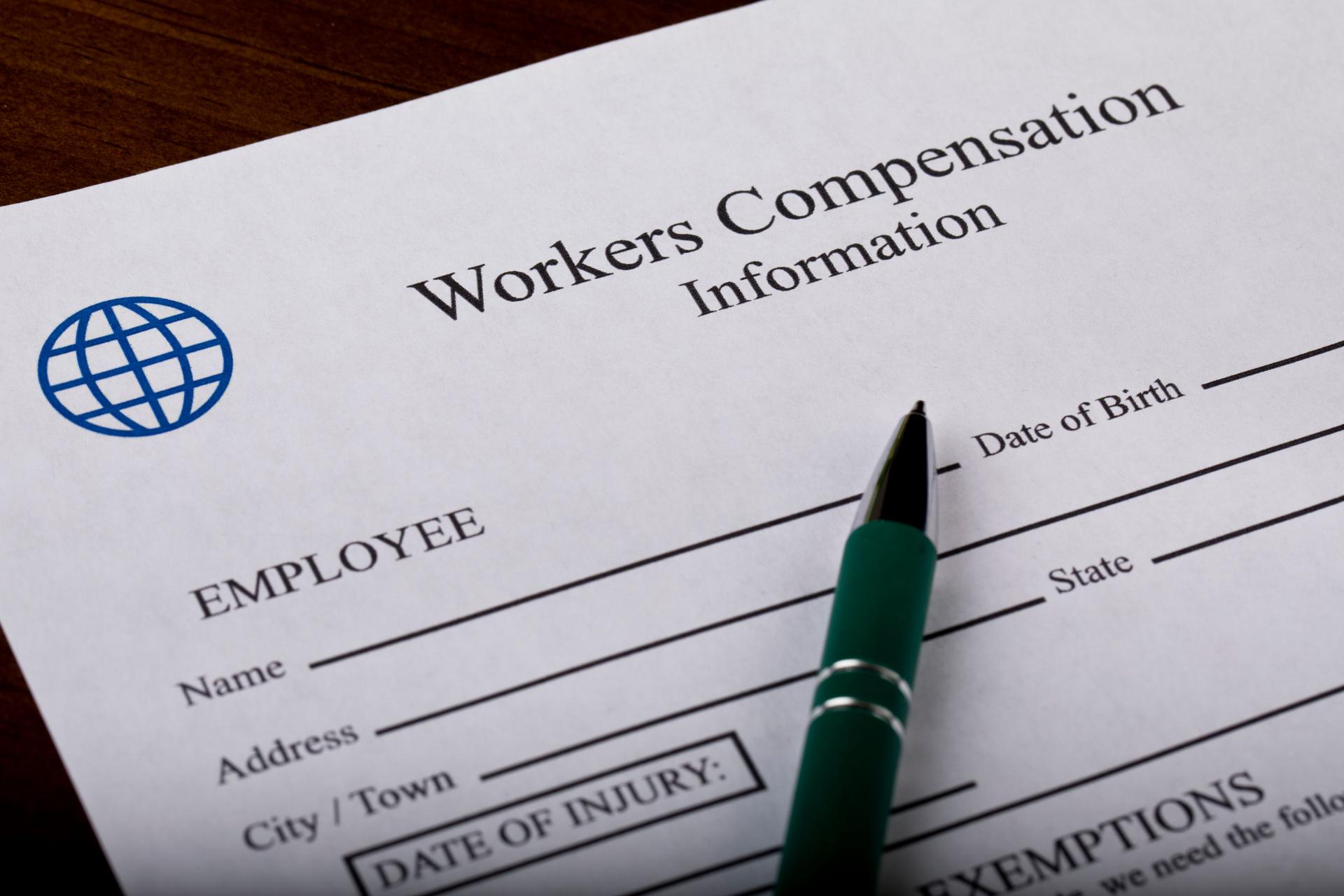 Worker Compensation Form and pen